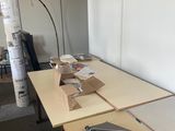 a desk with a laptop and a wallet on it