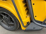 a close up of a yellow school bus with its door open
