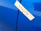blue car with a ruler attached to the side of it ' s door
