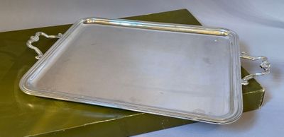 a silver tray sitting on top of a green box