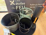 two buckets and a bag of food on a table