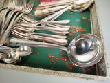 a tray with silverware and spoons on a table