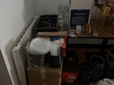 a small kitchen with a lot of clutter on the floor