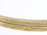 a close up picture of a gold colored metal ring