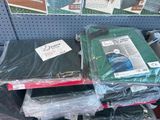 a pile of computer equipment on a shelf in a store