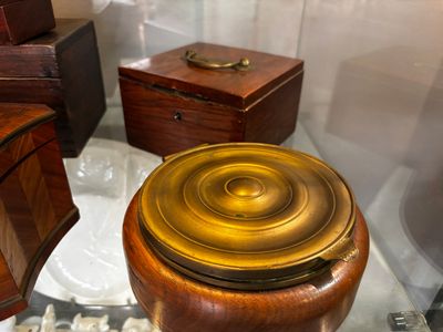 a toilet with a wooden seat and a wooden lid