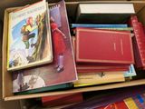 a box full of books that are sitting on the floor