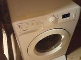 an image of a washing machine in the corner of a room