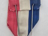 an image of a medal with a cross and a star on it