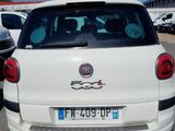 a small white car parked in a parking lot