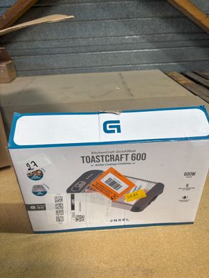 a cardboard box with a picture of a toaster on top of it