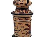 a small decorative box with a lid on a white background