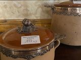 two pots on a table with a price tag on them