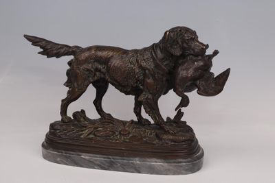 statue of a dog with a duck in its mouth on a marble base