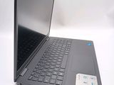 a black laptop computer sitting on top of a white table