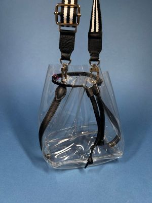 a clear bag that has a pair of scissors in it