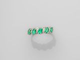 an emerald and diamond ring