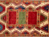 an old rug with a multicolored design on it