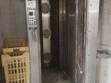 a metal door that is open in a room