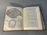 an open book with a drawing of a human head and a human eye