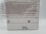packaging of a white box with a label on it sitting on a white surface
