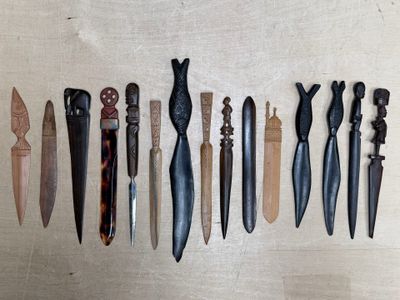 several different types of knives are lined up on a table