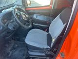 a small car with two seats and a steering wheel