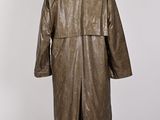 a brown leather coat with a fur collar on a mannequin stand