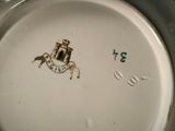 a white plate with a picture of a castle on it
