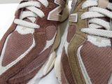 a close up of a pair of sneakers on a table