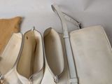 a purse and a pair of shoes on a table