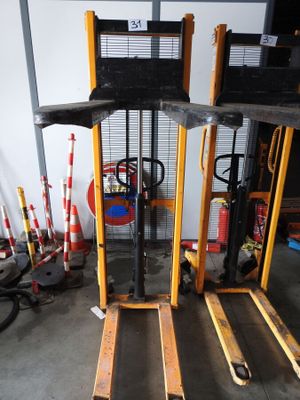 a fork lift truck that is parked in a garage