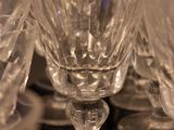 several empty wine glasses sitting on top of a black table