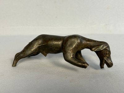 bronze statue of a bear on a white surface