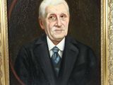 painting of a man in a suit and tie in a gold frame