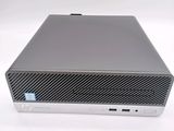 the front view of a desktop computer on a white surface