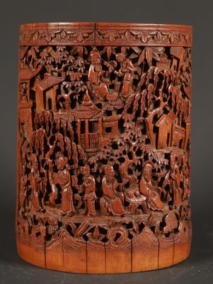 a large chinese carved wooden brush holder with scenes of people and animals