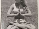 black and white photograph of a woman sitting in a yoga pose