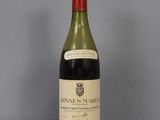 a bottle of wine that is sitting on a table