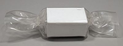 a white box with two empty glasses on top of it