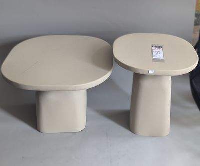 pair of round side tables with a small table top and a smaller one on each side