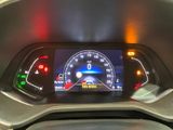 a car dashboard with a speedometer and a clock on it