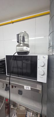 a microwave sitting on top of a counter in a kitchen