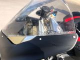 a close up of a motorcycle that is parked on the side of the road