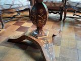 a table that has a vase on top of it