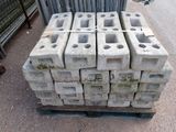 a pile of concrete blocks stacked on a pallet