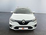 the front view of a white car parked in a showroom