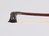an old axe with a wooden handle on top of a wooden stick