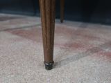a close up view of a wooden table with a glass top