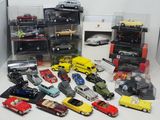 a lot of toy cars that are in a display case